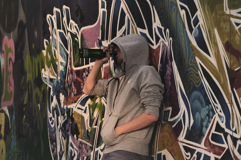 young man showing sign of alcoholism